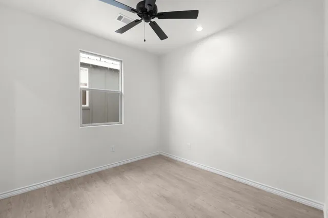 a bathroom with a toilet and a bathtub