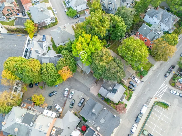 an aerial view of residential houses with outdoor space