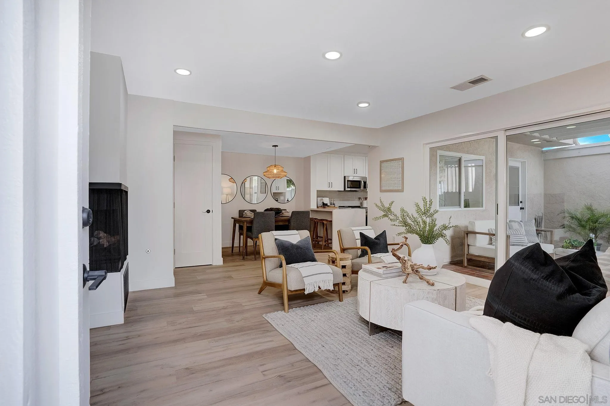 1344 Caminito Septimo Cardiff, CA 92007 - Photo 4 of 10 a living room with furniture and a flat screen tv