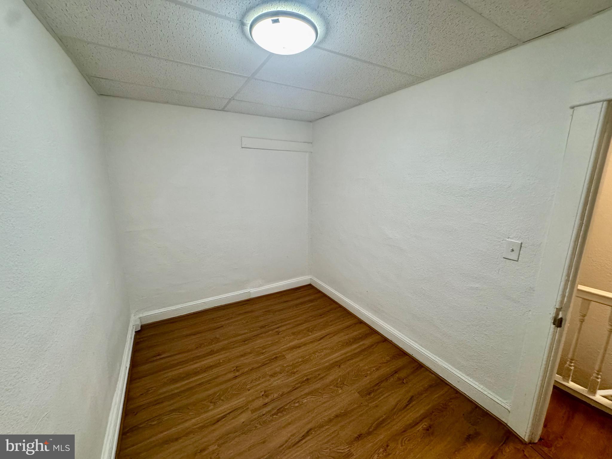 2012 Cliftwood Avenue Baltimore, MD 21213 - Photo 18 of 25 a view of a room with wooden floor