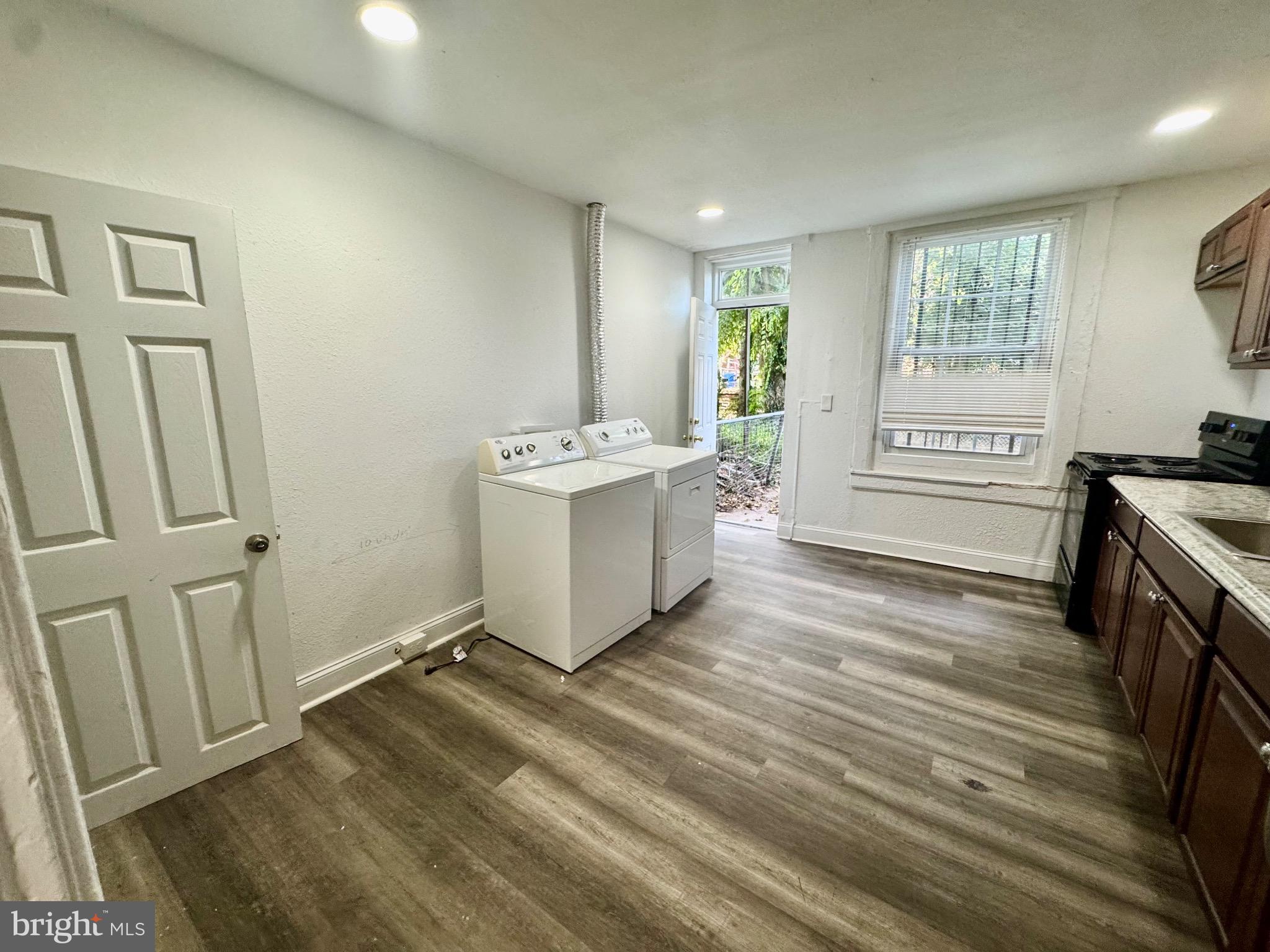 2012 Cliftwood Avenue Baltimore, MD 21213 - Photo 5 of 25 a view of a kitchen with fridge and wooden floor