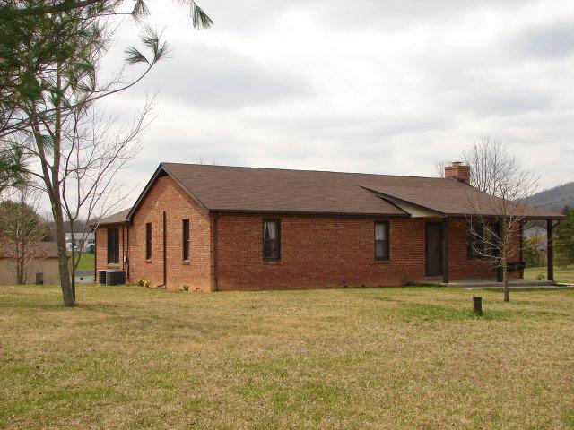 2888 Quarles Road Thaxton, VA 24174 - Photo 1 of 6 a front view of a house with a yard