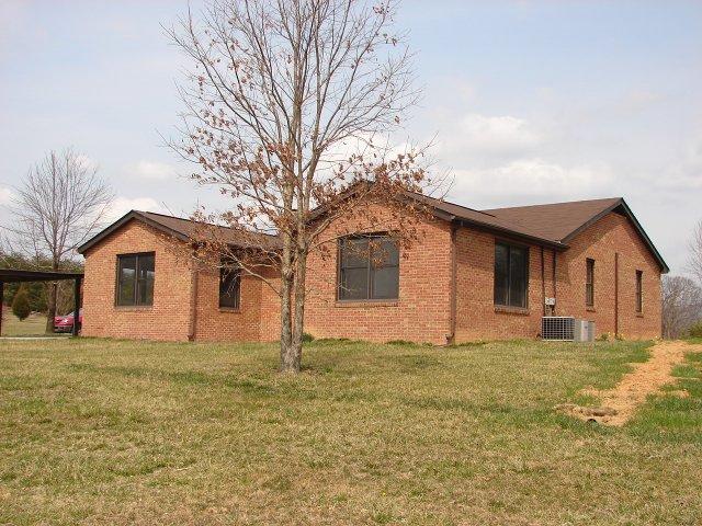 2888 Quarles Road Thaxton, VA 24174 - Photo 3 of 6 a front view of a house with a yard