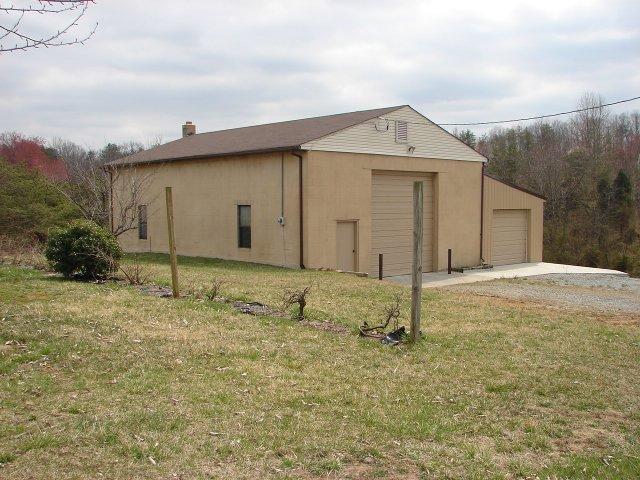 2888 Quarles Road Thaxton, VA 24174 - Photo 4 of 6 a view of a house with backyard and garden