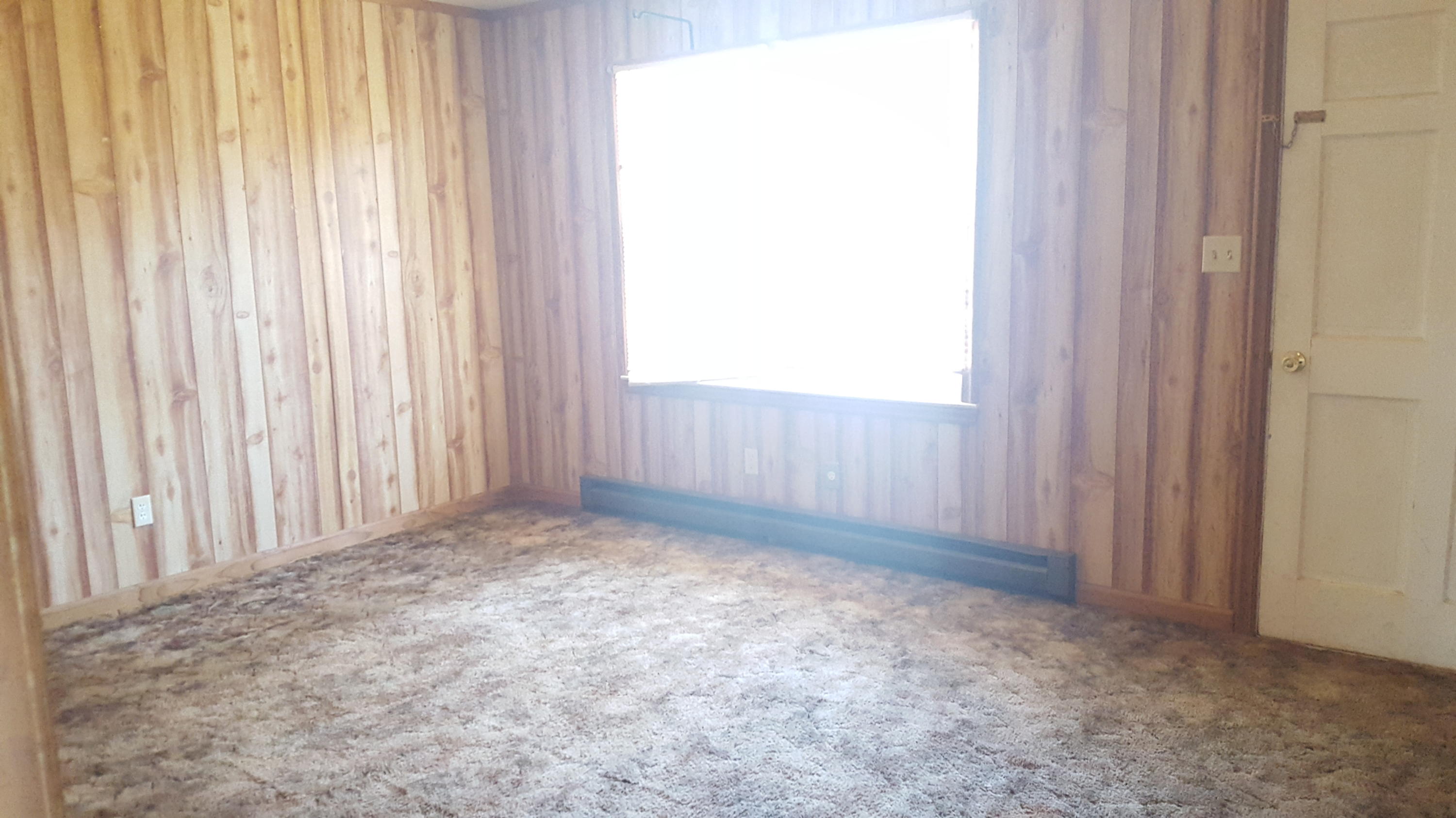 9825 Henry Road Henry, VA 24102 - Photo 4 of 6 an empty room with a window