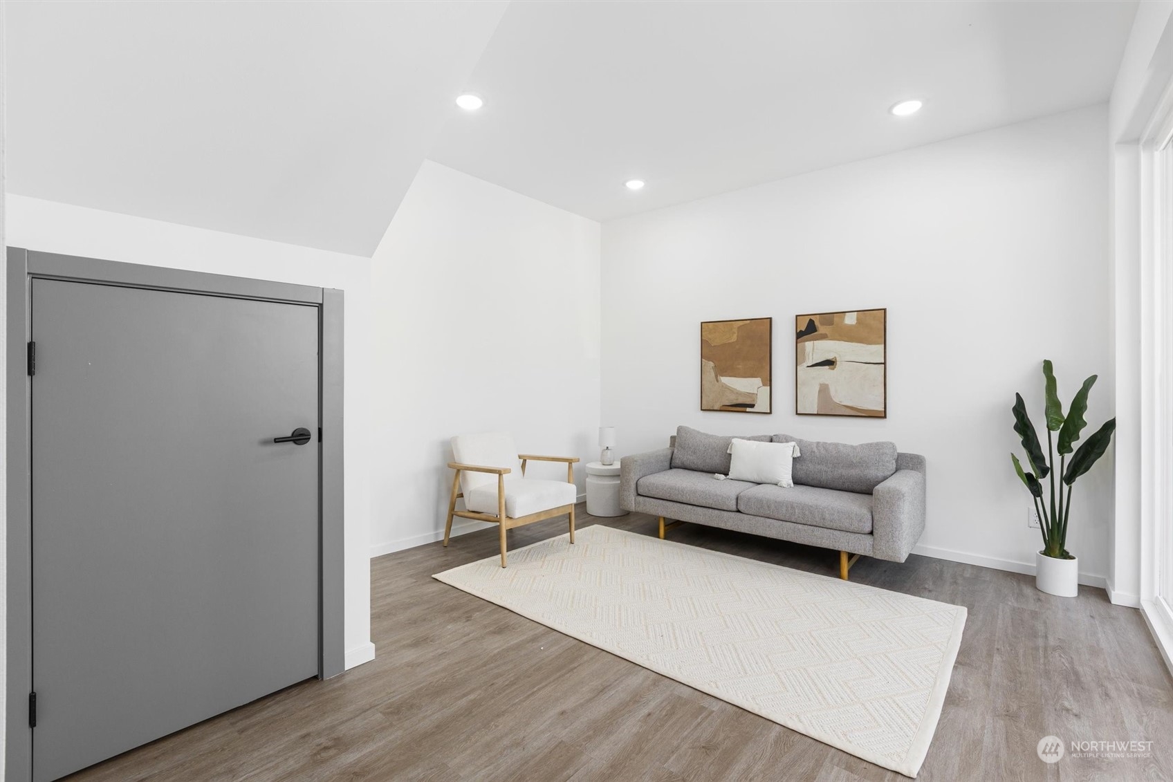 2605 Southwest Nevada Street Seattle, WA 98126 - Photo 11 of 24 a living room with furniture and a wooden floor