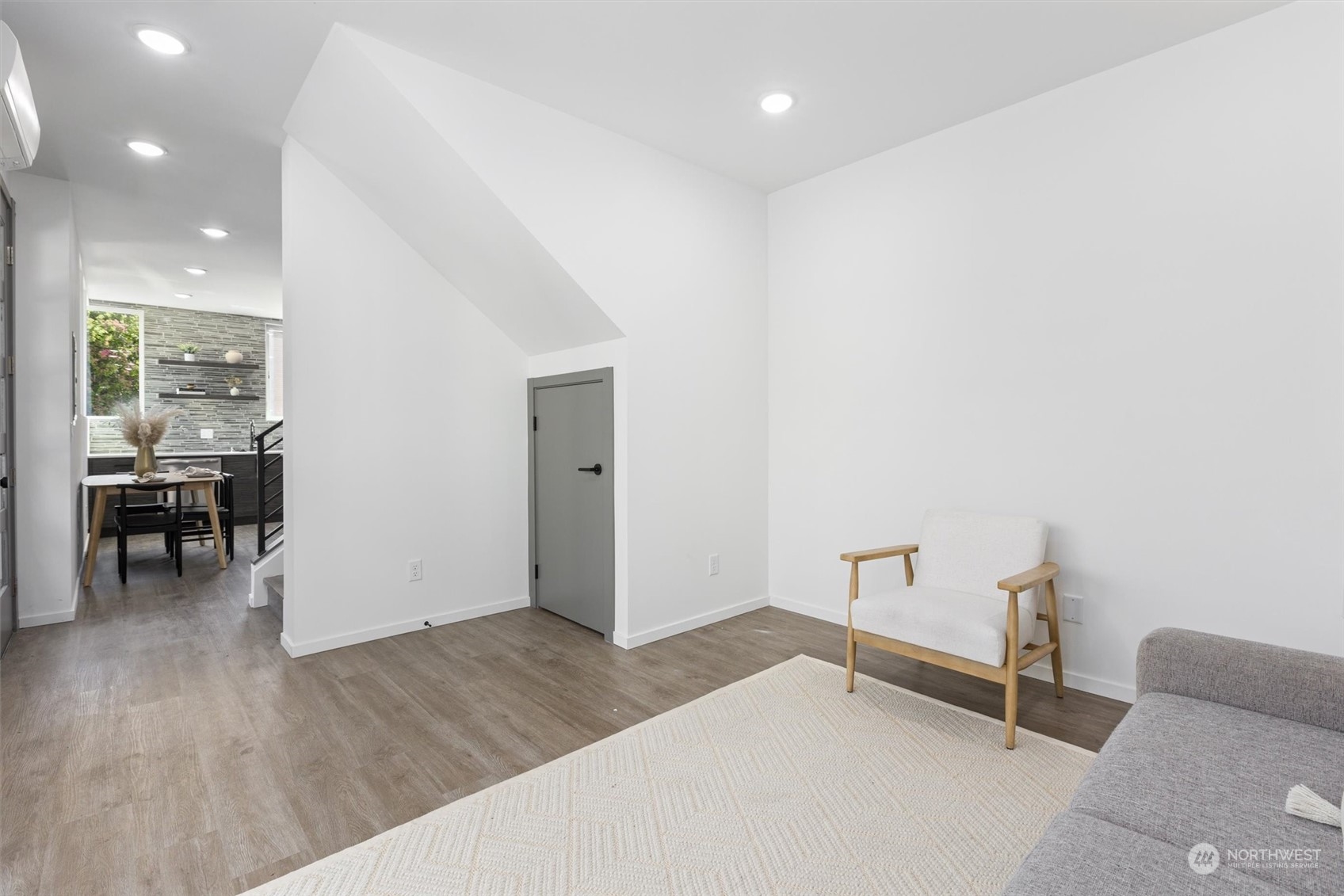 2605 Southwest Nevada Street Seattle, WA 98126 - Photo 13 of 24 a view of a livingroom with furniture and hardwood floor
