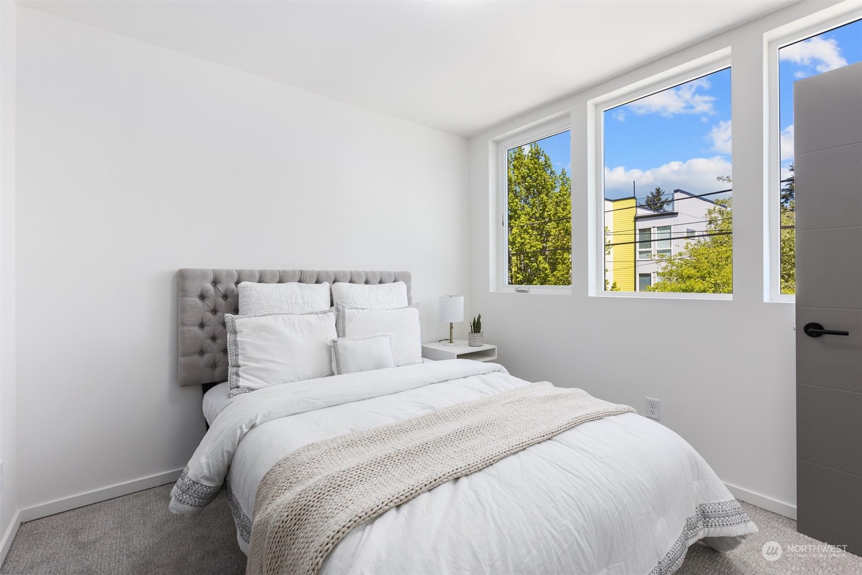 2605 Southwest Nevada Street Seattle, WA 98126 - Photo 17 of 24 a bedroom with a large bed and a window