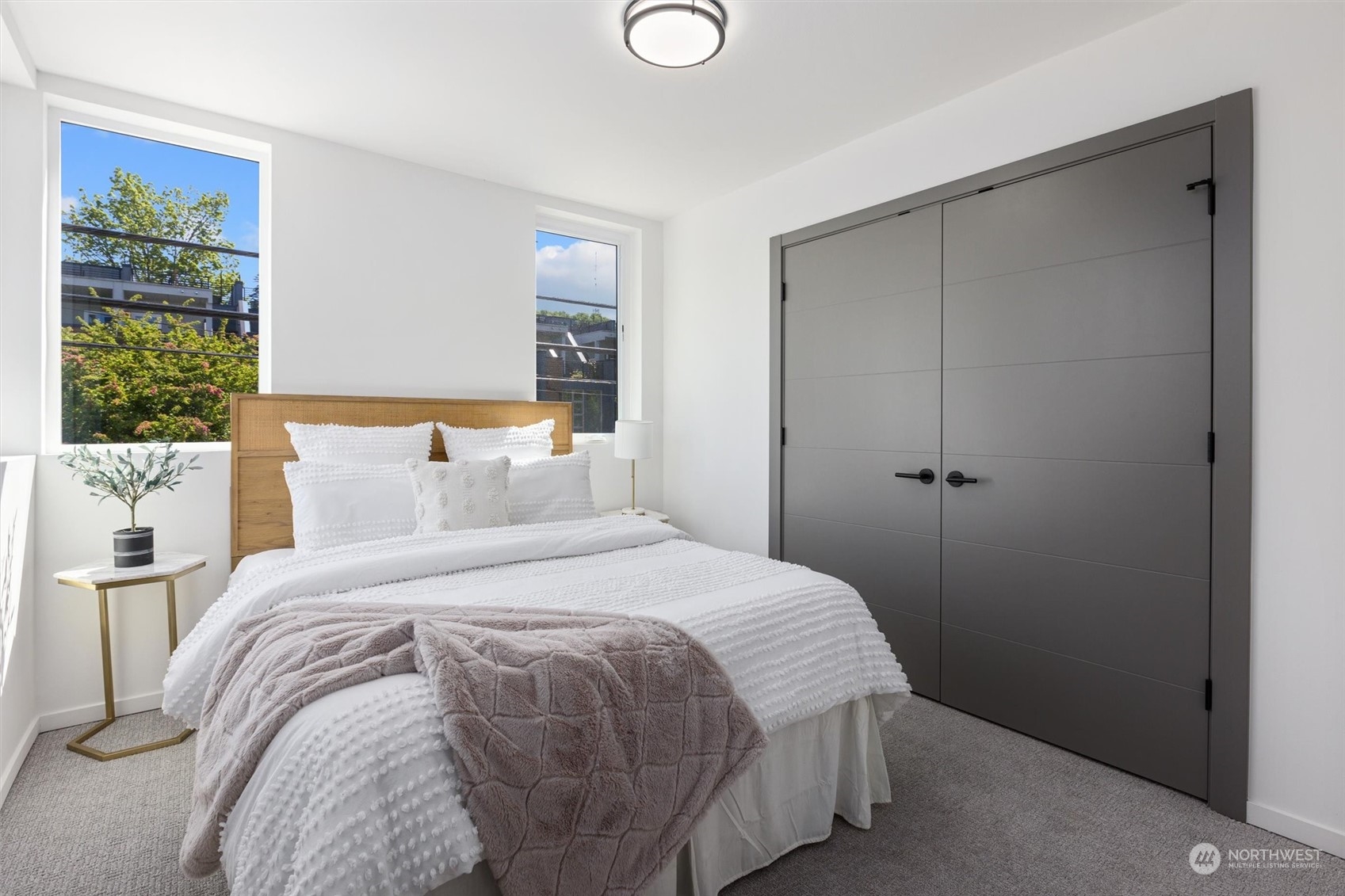 2605 Southwest Nevada Street Seattle, WA 98126 - Photo 20 of 24 a bedroom with a bed and a painting on the wall