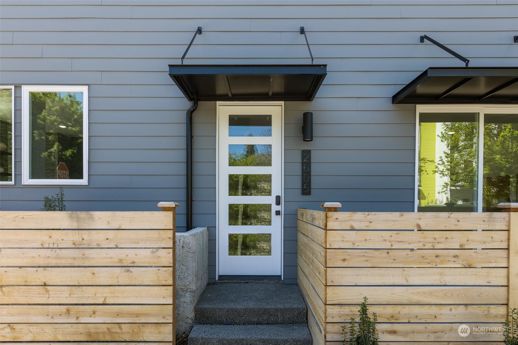 2605 Southwest Nevada Street Seattle, WA 98126 - Photo 3 of 24 a front view of a house with a window
