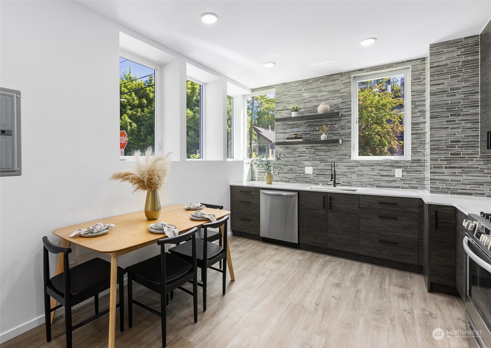 2605 Southwest Nevada Street Seattle, WA 98126 - Photo 5 of 24 a kitchen with a table and chairs in it