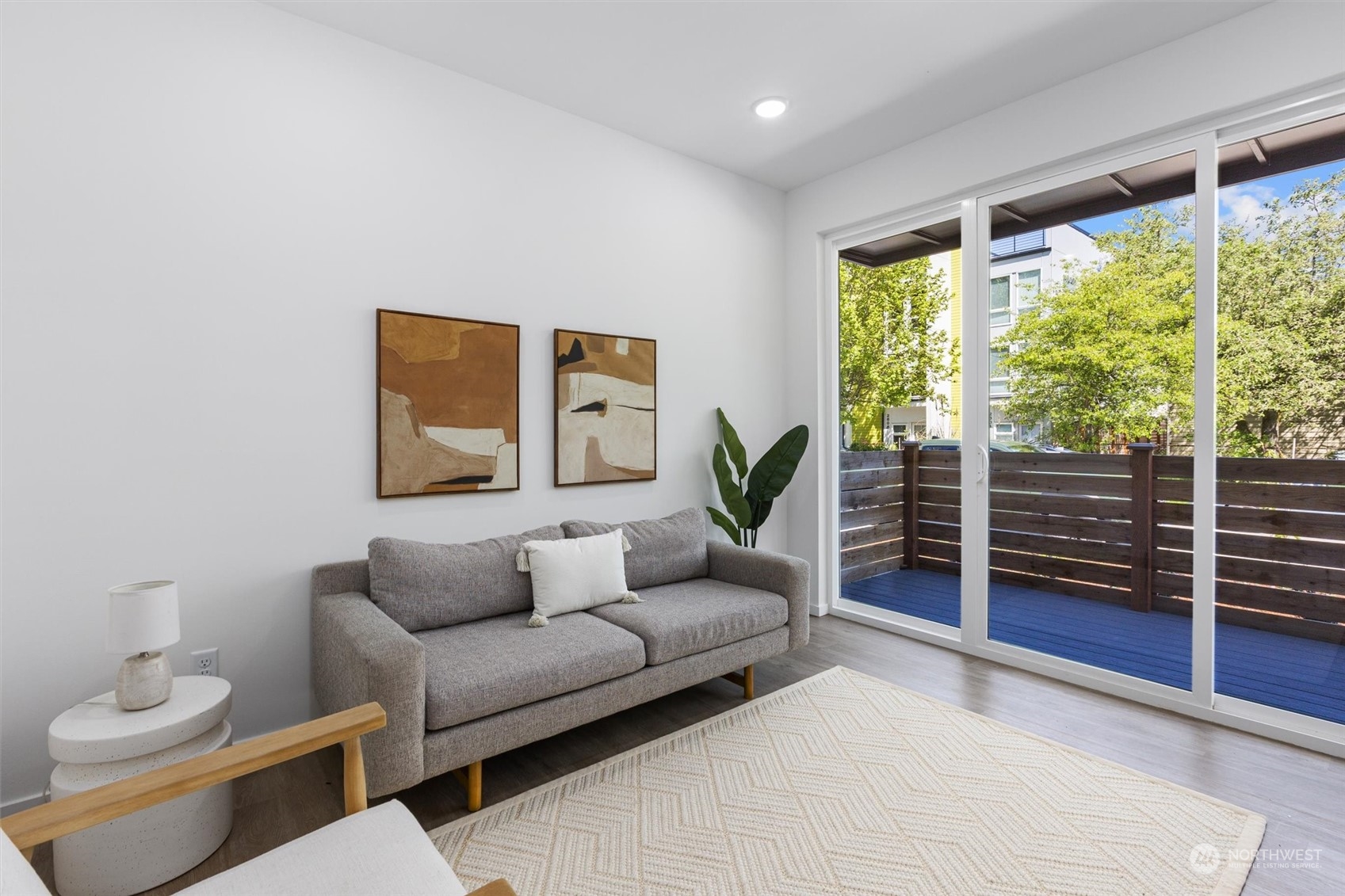2605 Southwest Nevada Street Seattle, WA 98126 - Photo 8 of 24 a living room with furniture a lamp and a large window