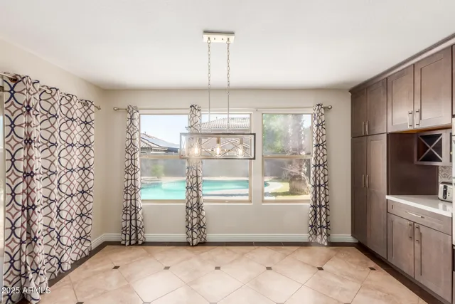 a view of a room with window and refrigerator