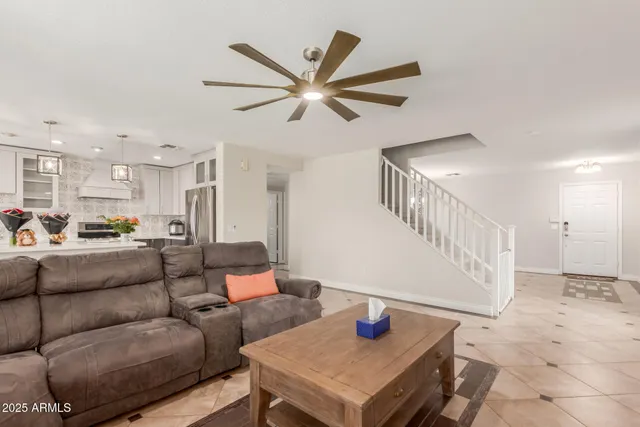 a living room with furniture and a table