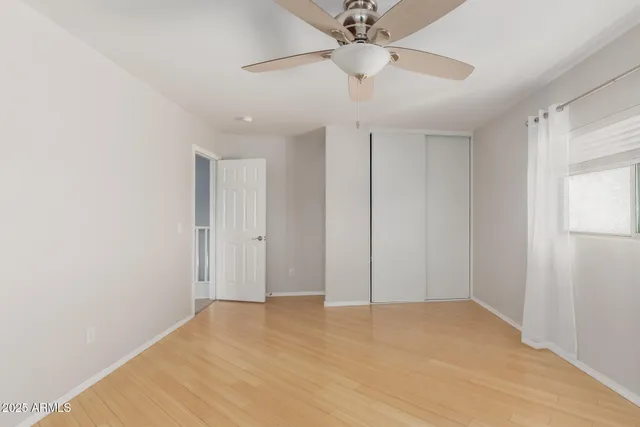 a view of an empty room with a window