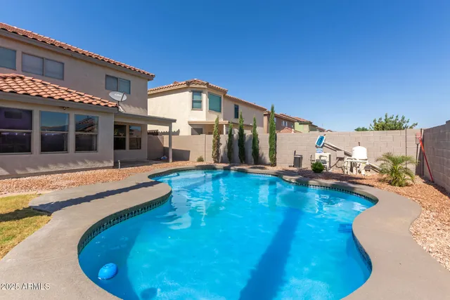 a view of a house with swimming pool