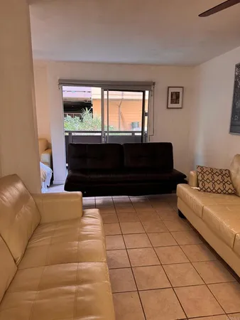 a living room with a couch and a view of living room