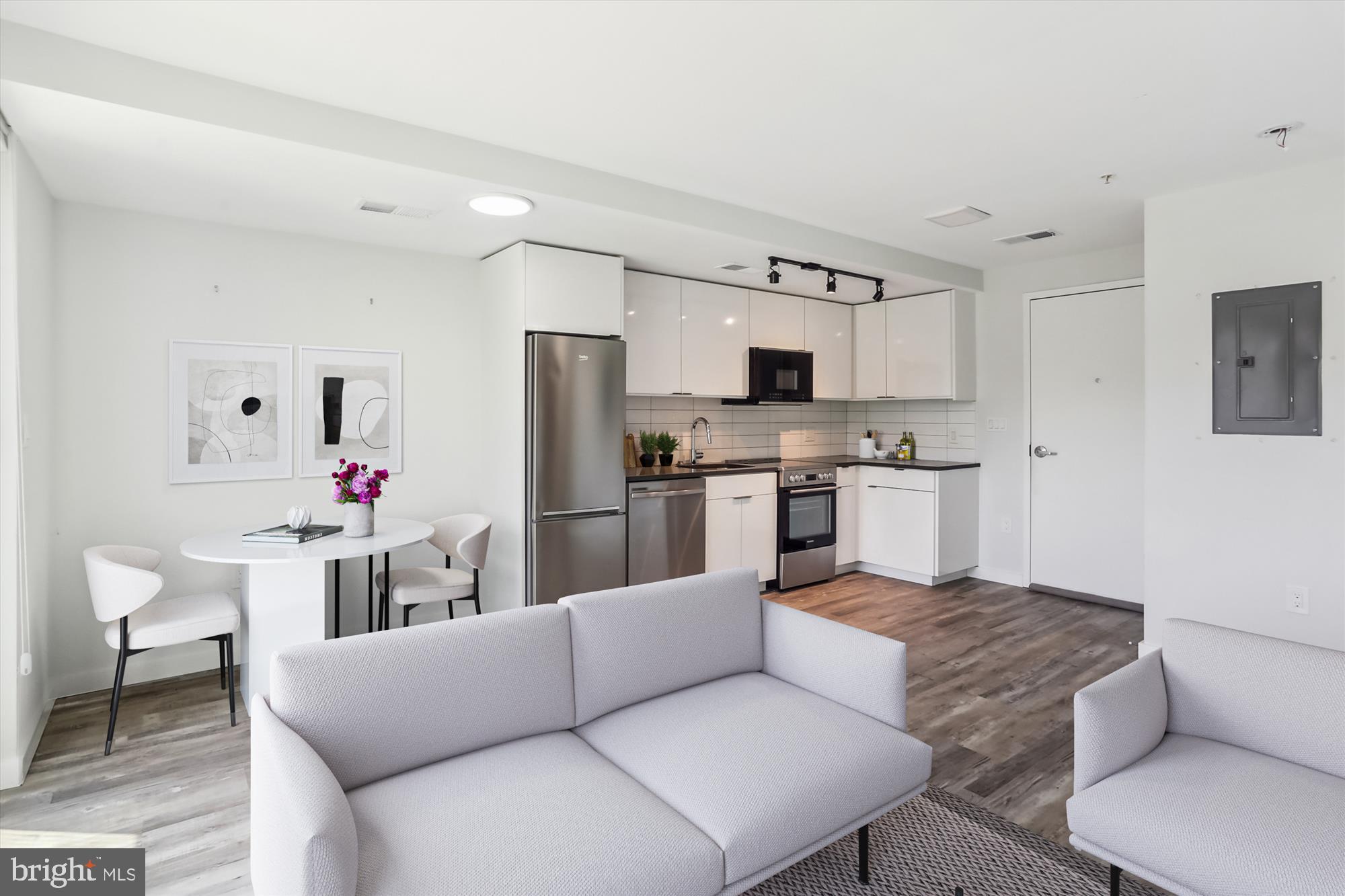 700 Roeder Road, Unit 401 Silver Spring, MD 20910 - Photo 13 of 30 a living room with stainless steel appliances furniture and a kitchen area