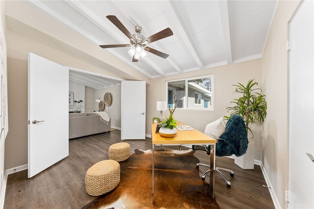 6737 Delco Avenue Winnetka, CA 91306 - Photo 19 of 31 a living room with furniture and wooden floor