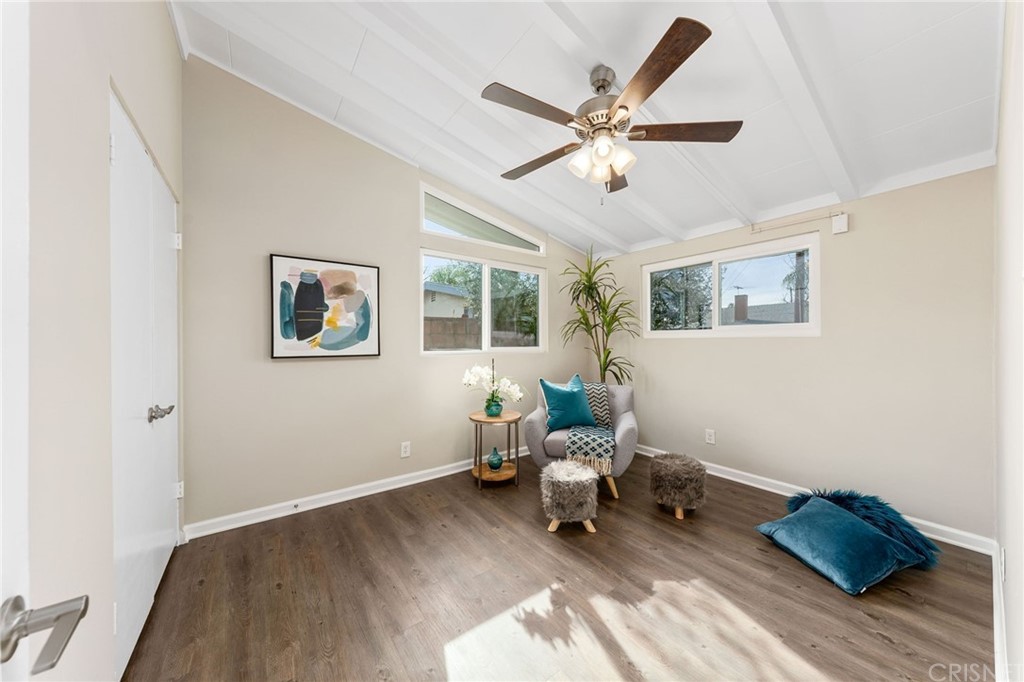 6737 Delco Avenue Winnetka, CA 91306 - Photo 23 of 31 a living room with furniture and a window