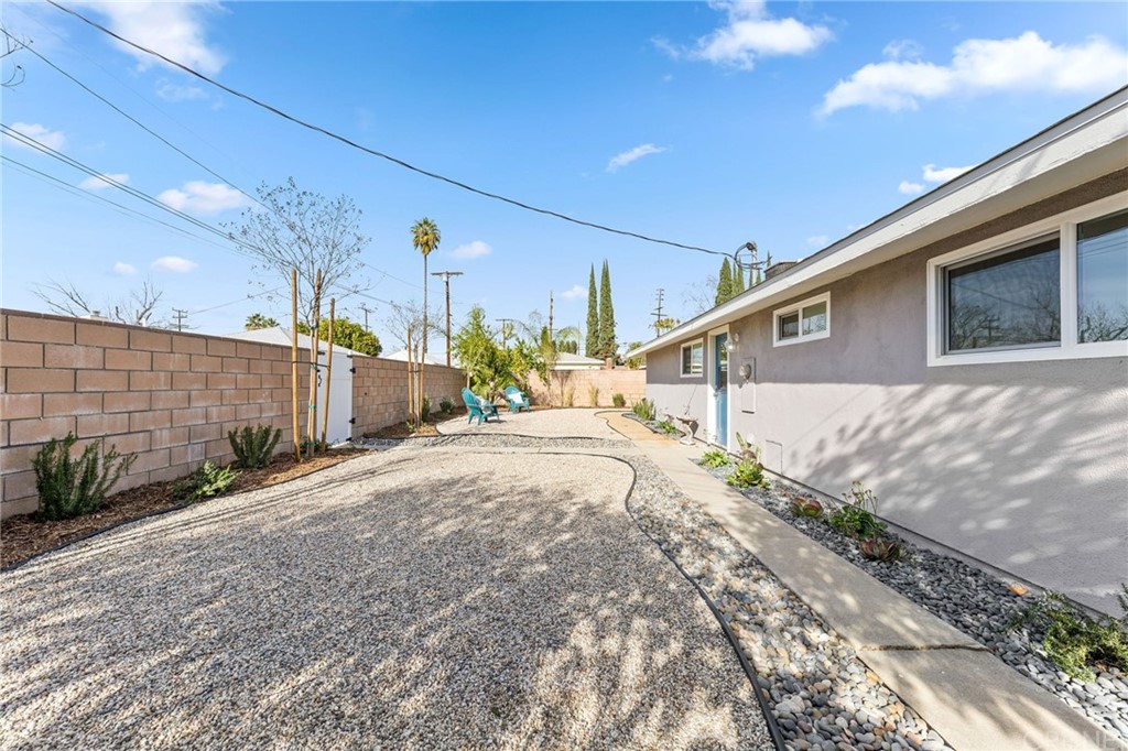 6737 Delco Avenue Winnetka, CA 91306 - Photo 27 of 31 a street view with wooden fence
