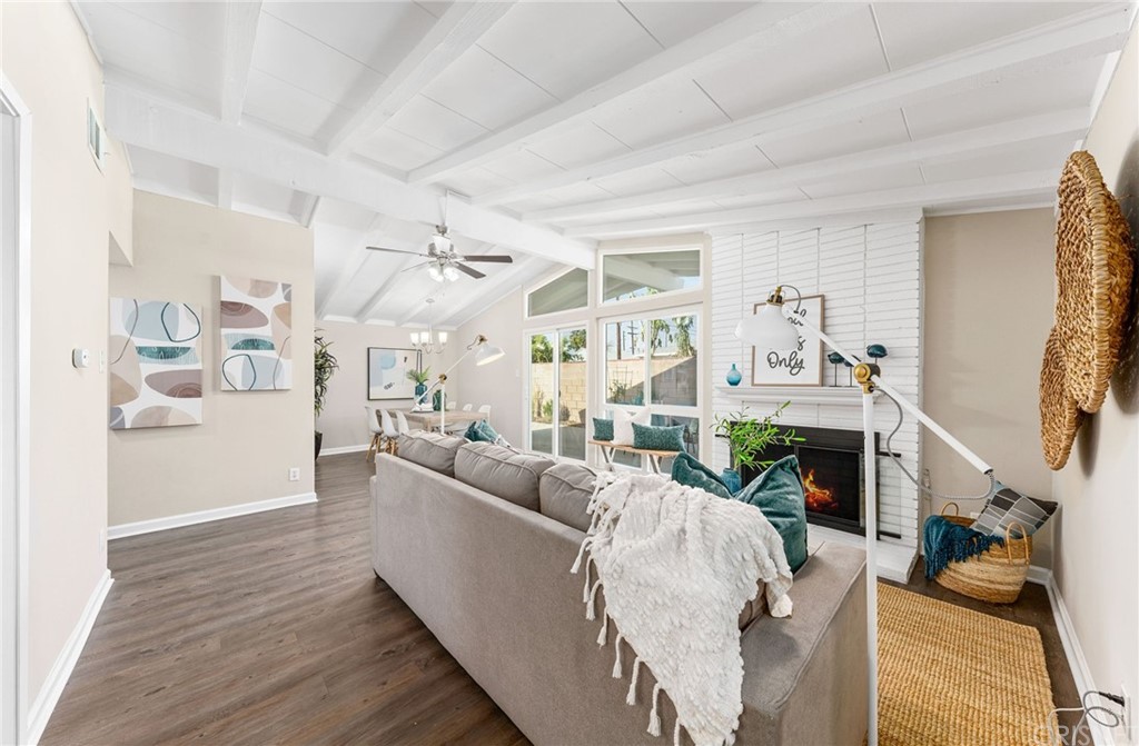 6737 Delco Avenue Winnetka, CA 91306 - Photo 3 of 31 a living room with furniture and a fireplace