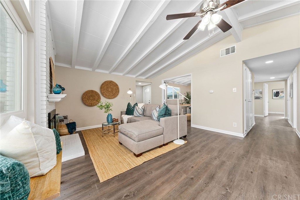 6737 Delco Avenue Winnetka, CA 91306 - Photo 8 of 31 a living room with furniture and a large window