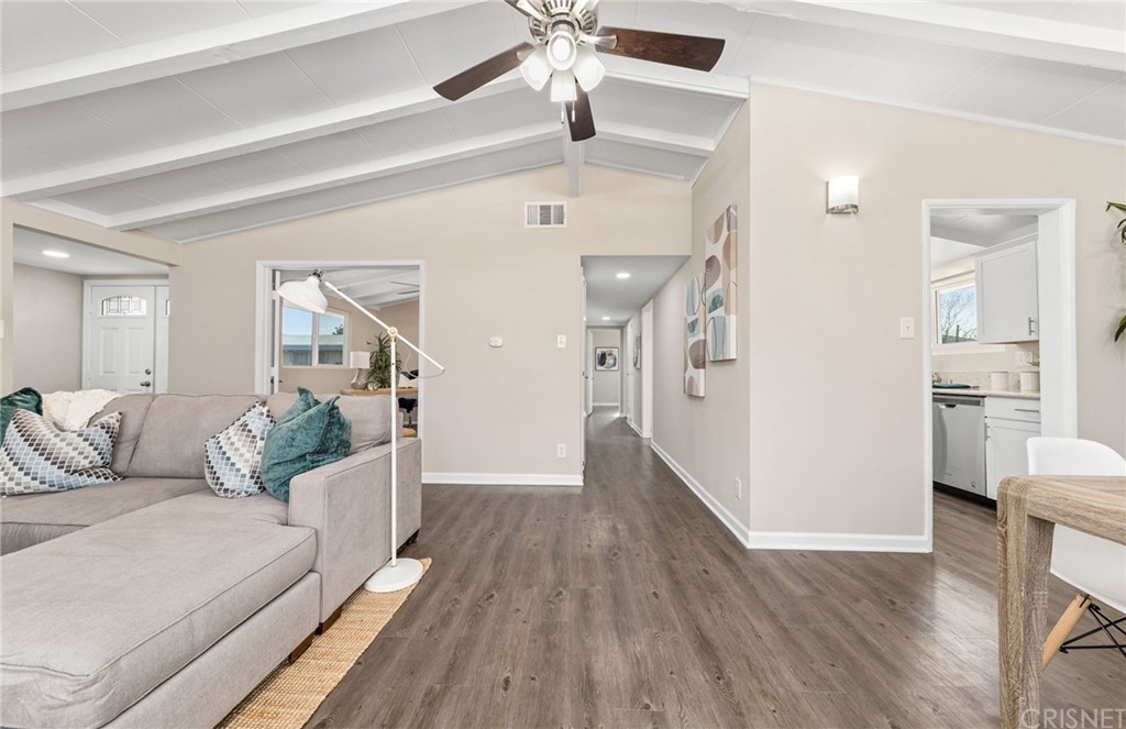 6737 Delco Avenue Winnetka, CA 91306 - Photo 9 of 31 a living room with furniture and a wooden floor
