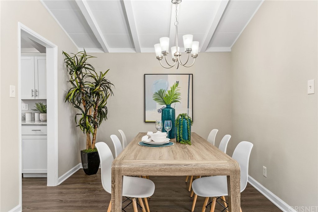 6737 Delco Avenue Winnetka, CA 91306 - Photo 10 of 31 a view of a dining room with furniture wooden floor and chandelier