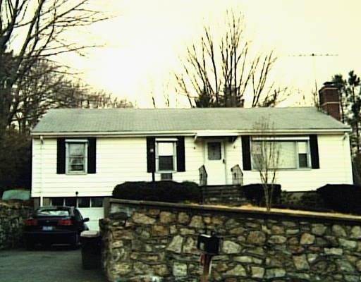 116 Davis Road Fairfield, CT 06825 - Photo 1 of 1 a front view of a house with a garden