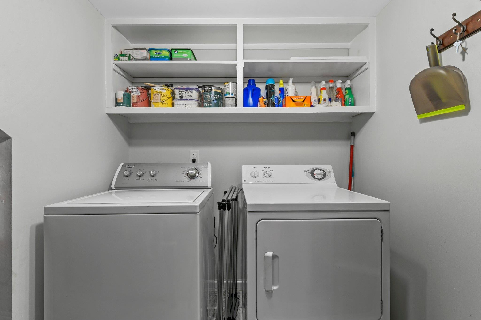 1502 Edgeside Court Raleigh, NC 27609 - Photo 10 of 27 Laundry Room on main floor with shelving above and built in storage on the side as well. Laundry