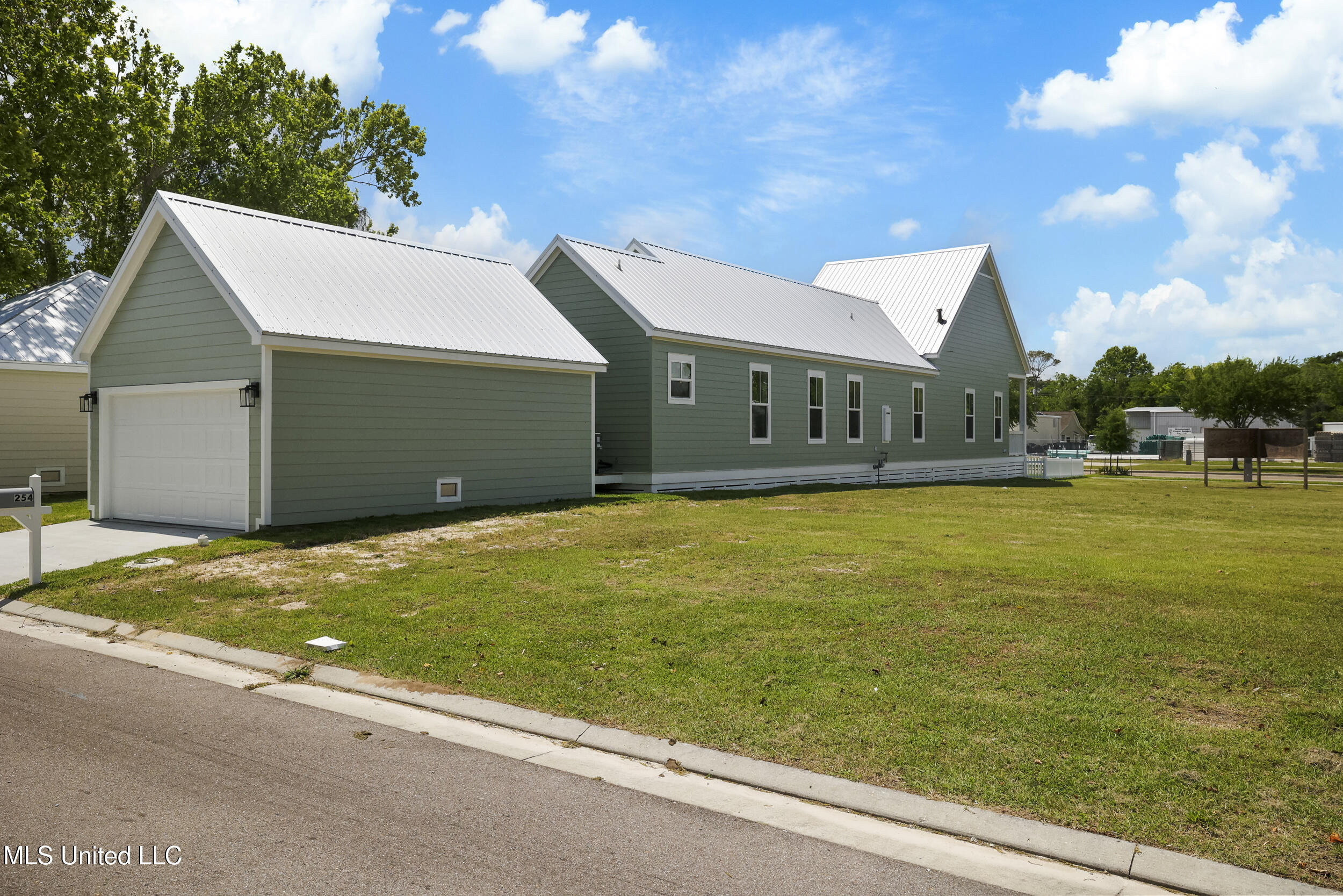254 Caillavet Street Biloxi, MS 39530 - Photo 34 of 44 GARAGE AND SIDE VIEW OF HOME