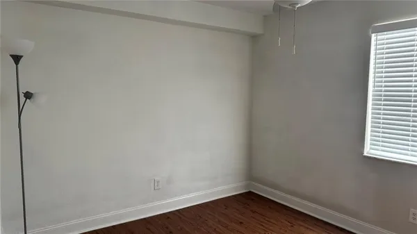 a view of closet area with empty racks