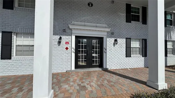 a view of a brick house with an outdoor space
