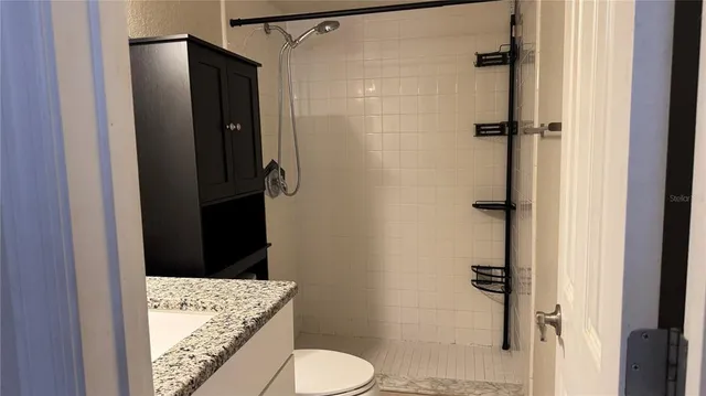 a view of closet with bathtub
