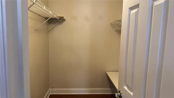 a view of front door with wooden floor