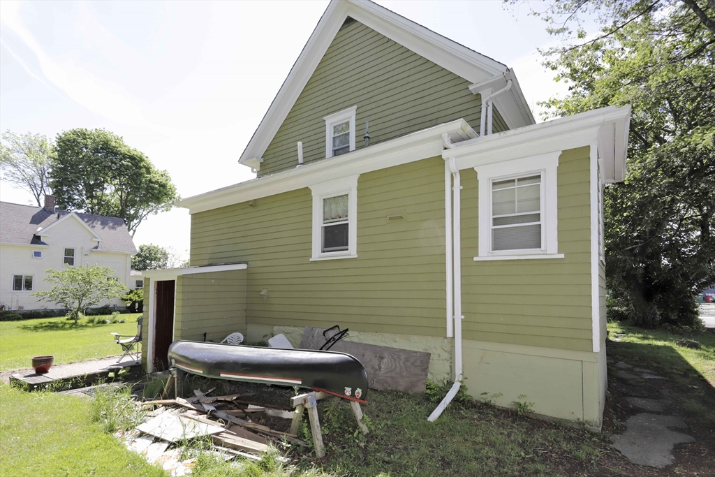 5 Anthony Street Acushnet, MA 02743 - Photo 8 of 37 a backyard of a house with yard table and chairs