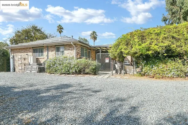 a front view of a house with a yard and a garage