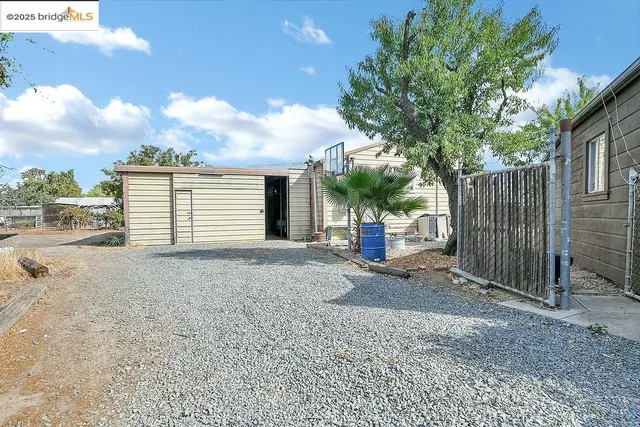 a view of backyard of a house