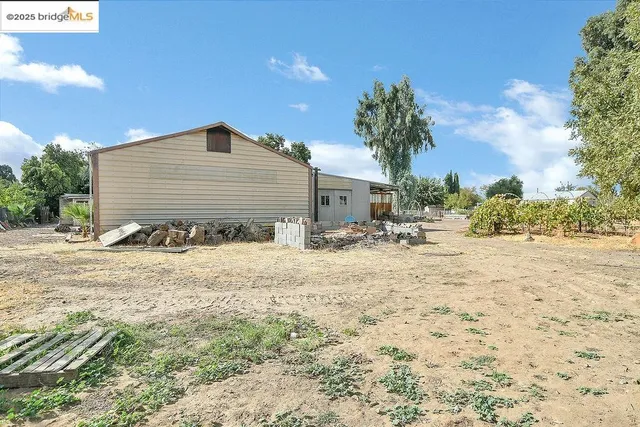 a kitchen with a refrigerator and a stove top oven