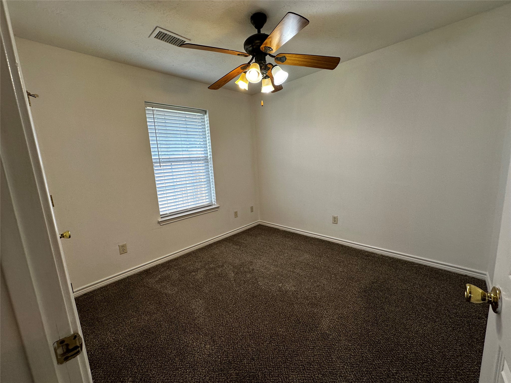 1400 Prairie Drive Bryan, TX 77802 - Photo 10 of 18 A well-proportioned bedroom with ample natural light from a window, offering comfort and simplicity.