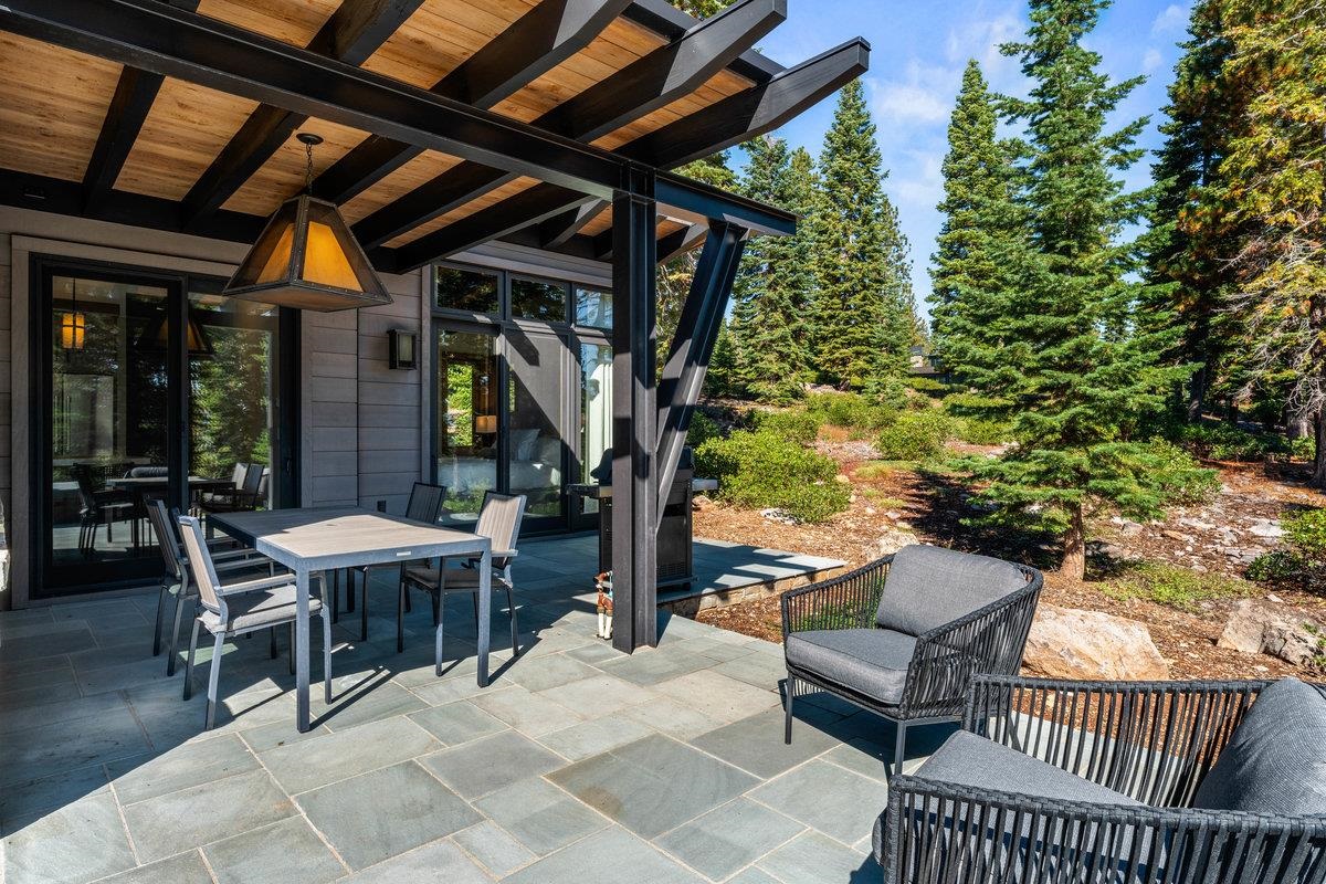8370 Valhalla Drive Truckee, CA 96161 - Photo 16 of 21 a view of a patio with table and chairs and potted plants