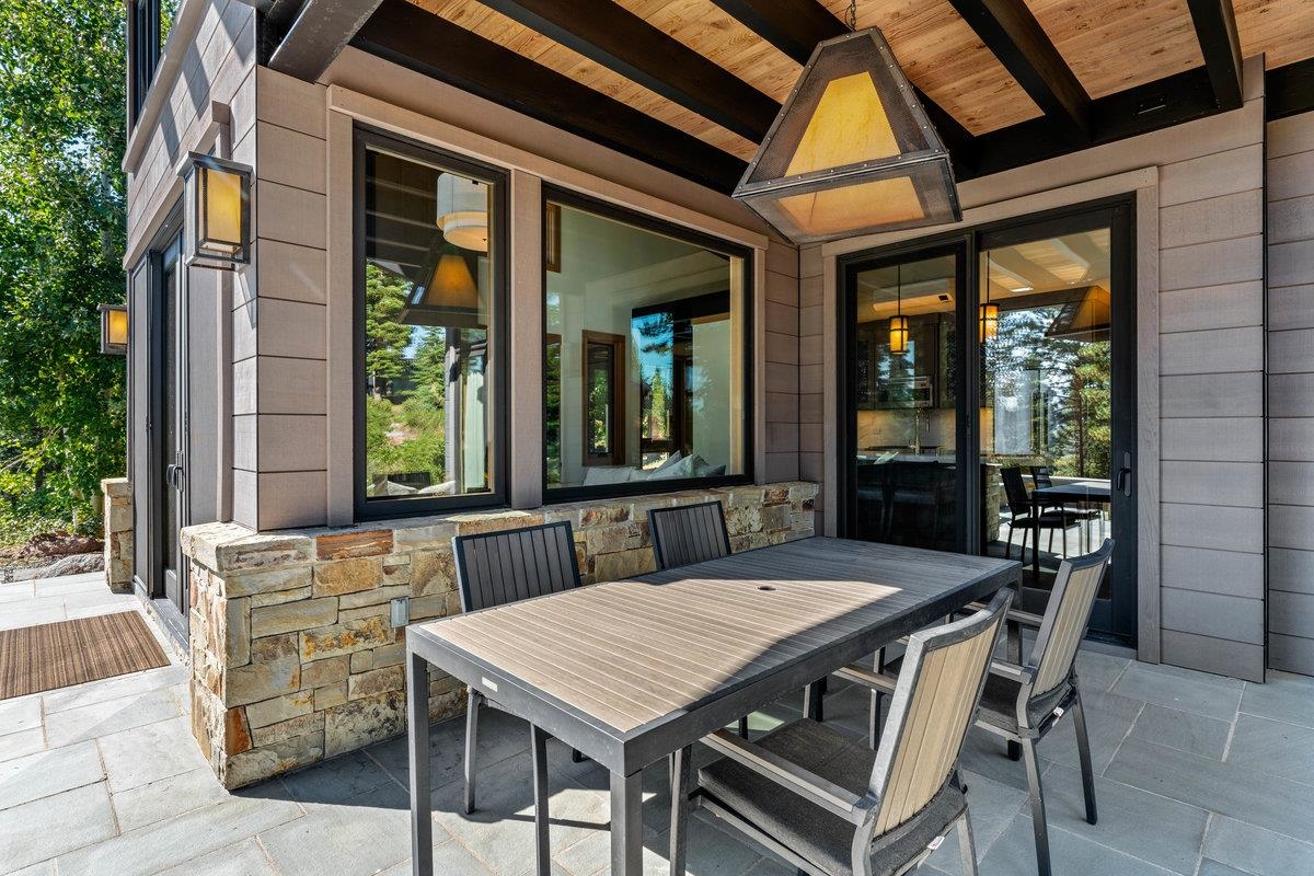 8370 Valhalla Drive Truckee, CA 96161 - Photo 17 of 21 a view of an outside dining space with a table and chairs
