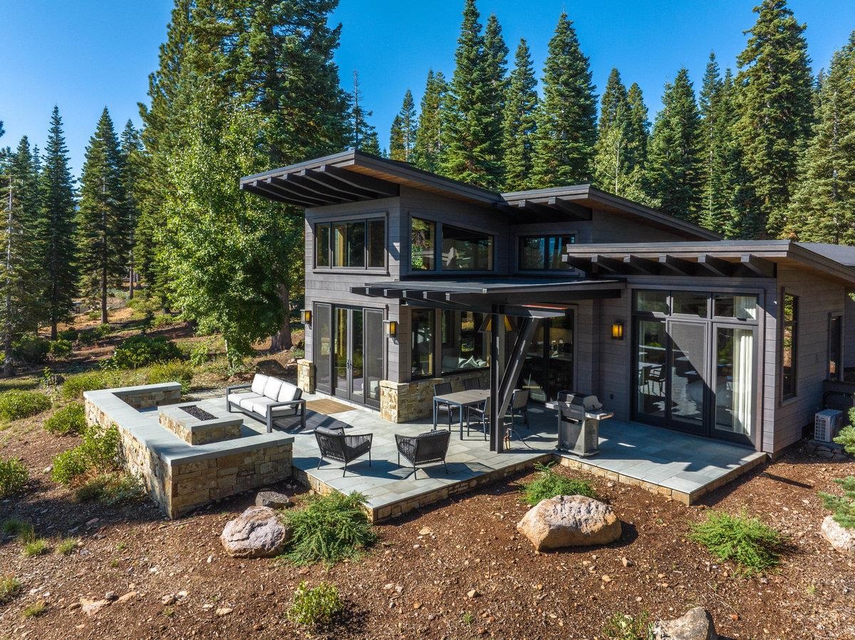 8370 Valhalla Drive Truckee, CA 96161 - Photo 2 of 21 a view of a patio with table and chairs under an umbrella