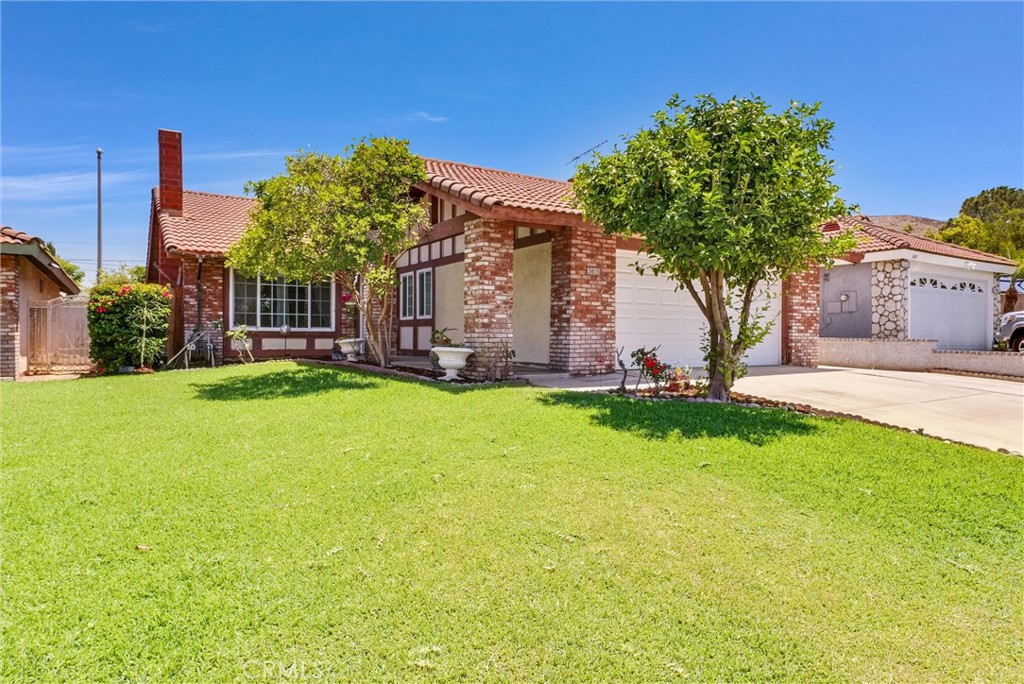 3415 Siskiyou Circle Riverside, CA 92503 - Photo 1 of 41 a front view of a house with a yard