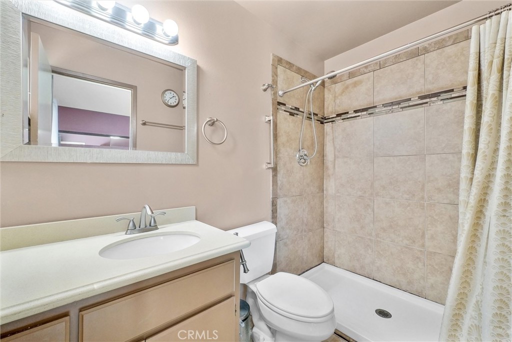 3415 Siskiyou Circle Riverside, CA 92503 - Photo 27 of 41 a bathroom with a sink toilet vanity and shower