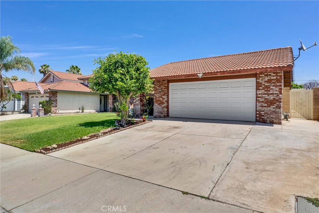 3415 Siskiyou Circle Riverside, CA 92503 - Photo 41 of 41 a front view of a house with a yard and garage