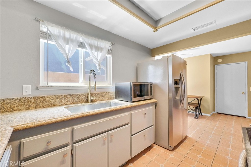 3415 Siskiyou Circle Riverside, CA 92503 - Photo 10 of 41 a kitchen with a sink and cabinets