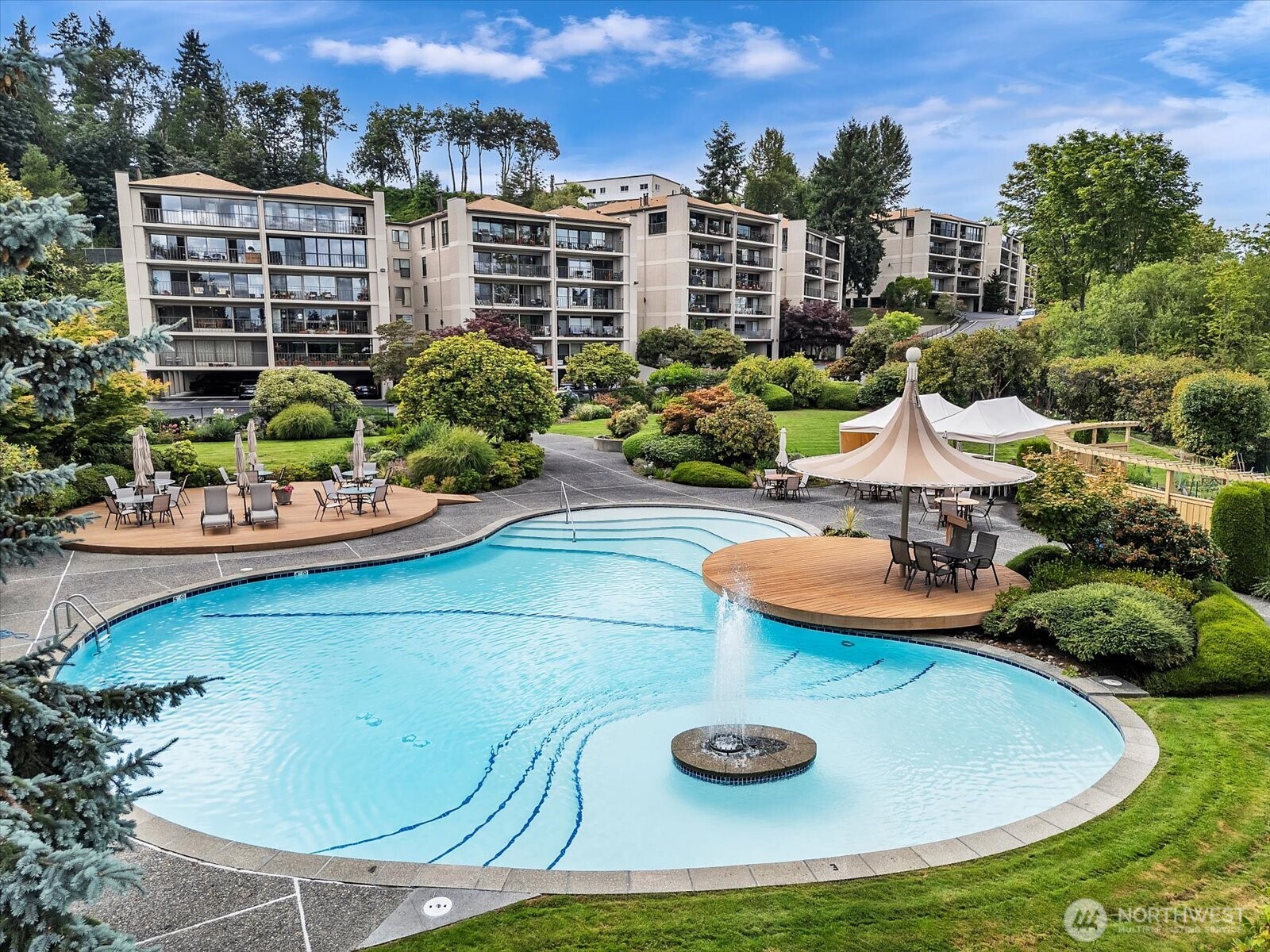 8001 Sand Point Way Northeast, Unit C57 Seattle, WA 98115 - Photo 1 of 23 a view of a swimming pool with chairs