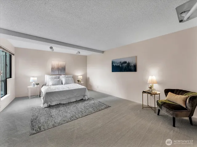 a living room with furniture and a lamp